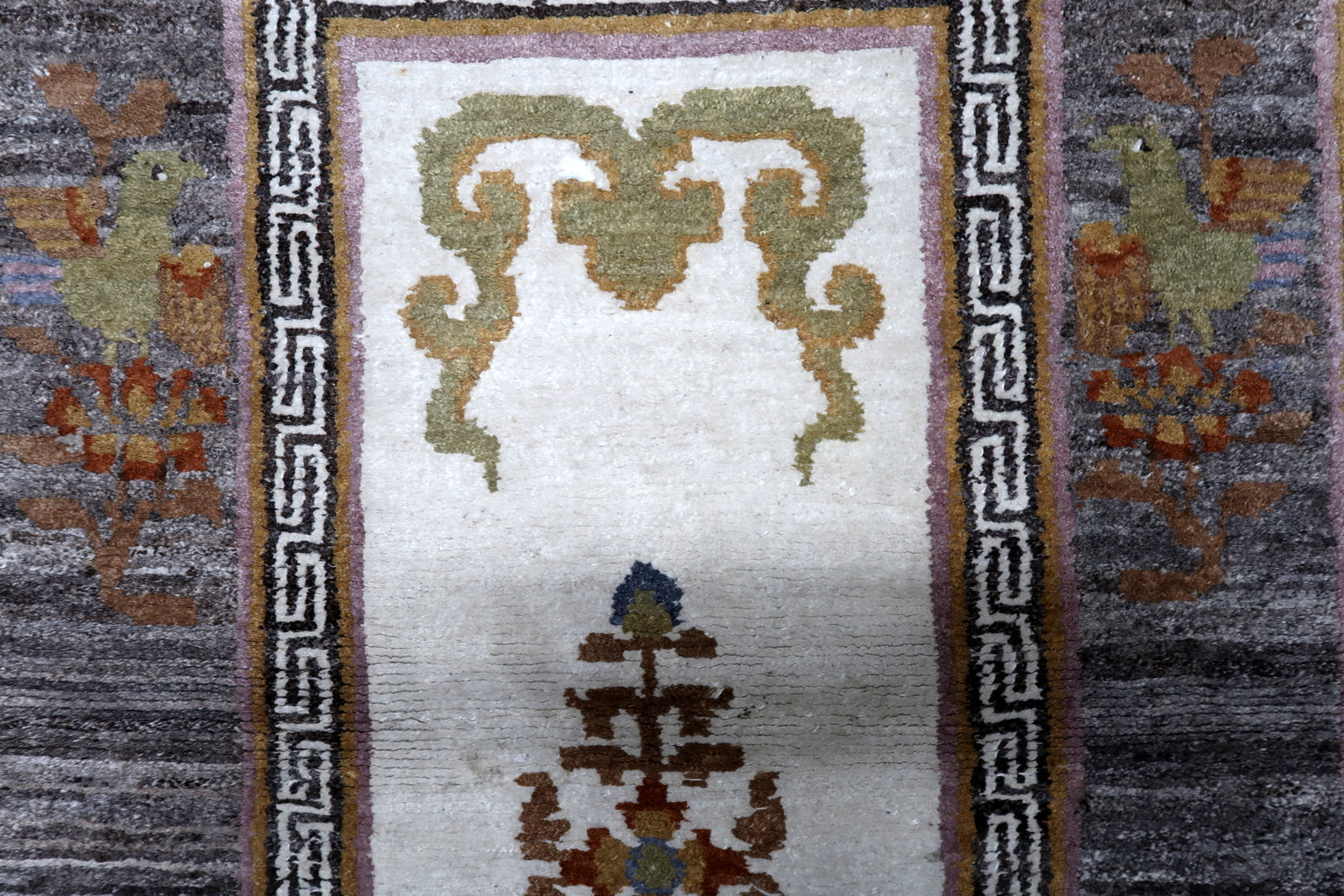 Handmade Khaden rug Tibet circa 1960s with charcoal ivory goldenrod and moss green colors

