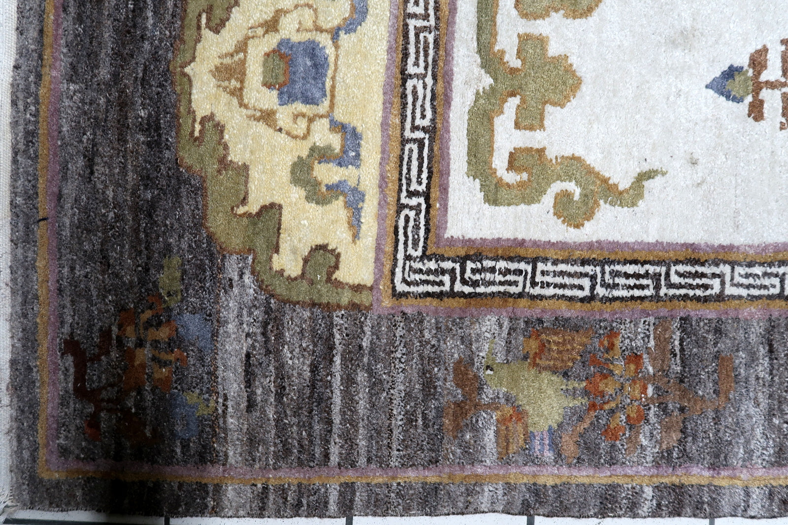 Central ivory panel with delicate Tree of Life motif on vintage Tibetan Art Deco rug
