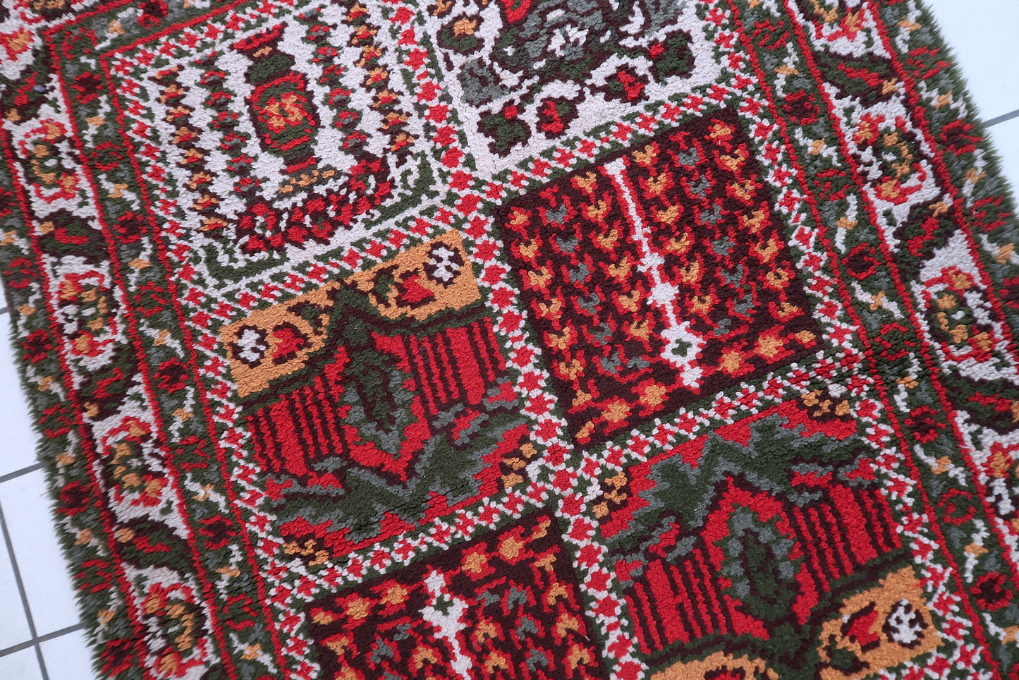 Hand-loomed French rug circa 1950s with cream field soft pink sage green and pale blue color palette

