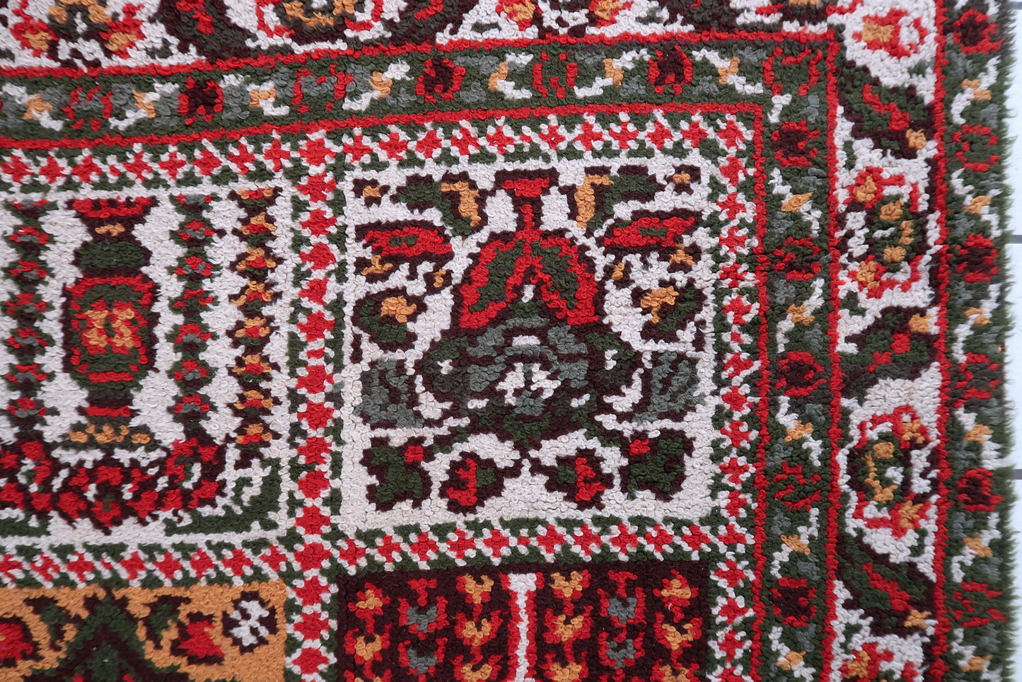 Refined central floral medallion anchored within spacious cream-toned open field on French Savonnerie rug