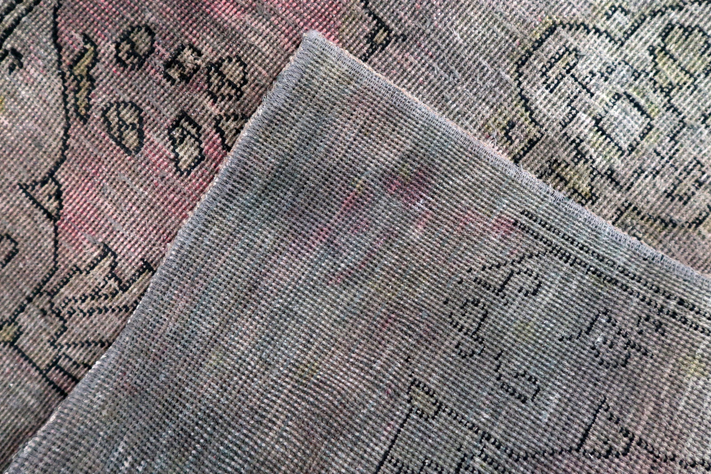 Detail of professionally secured edges with authentic visible wear and distressed character