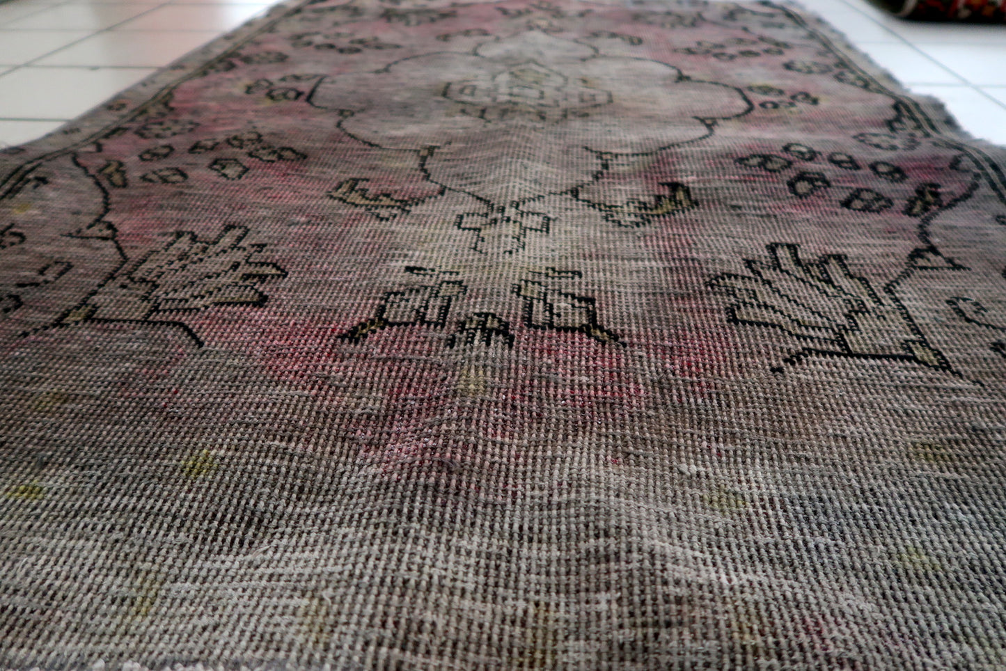 Close-up of striking aged palette with sun-faded terracotta deep indigo and weathered charcoal