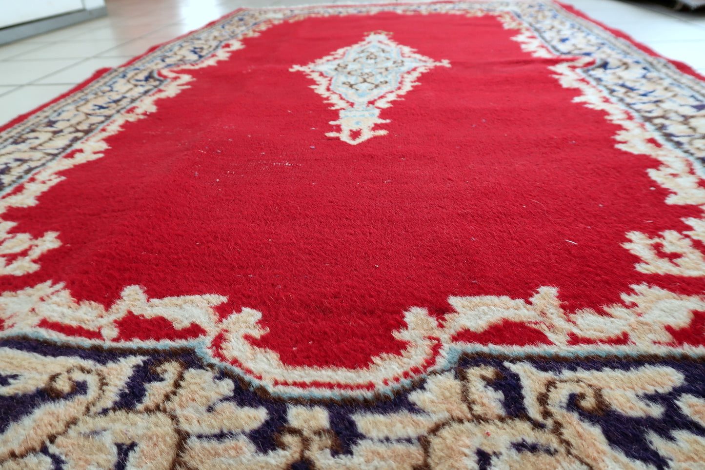 Detail of multi-layered floral border framing timeless composition of soft creams and rose pinks