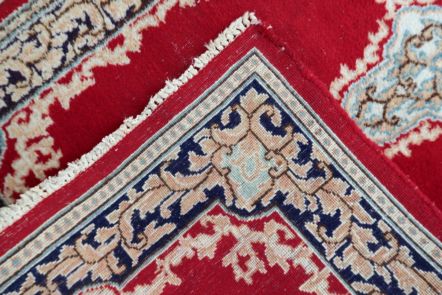 Corner detail showing intricate knotting and natural dyes on 1950s Persian Kerman rug
