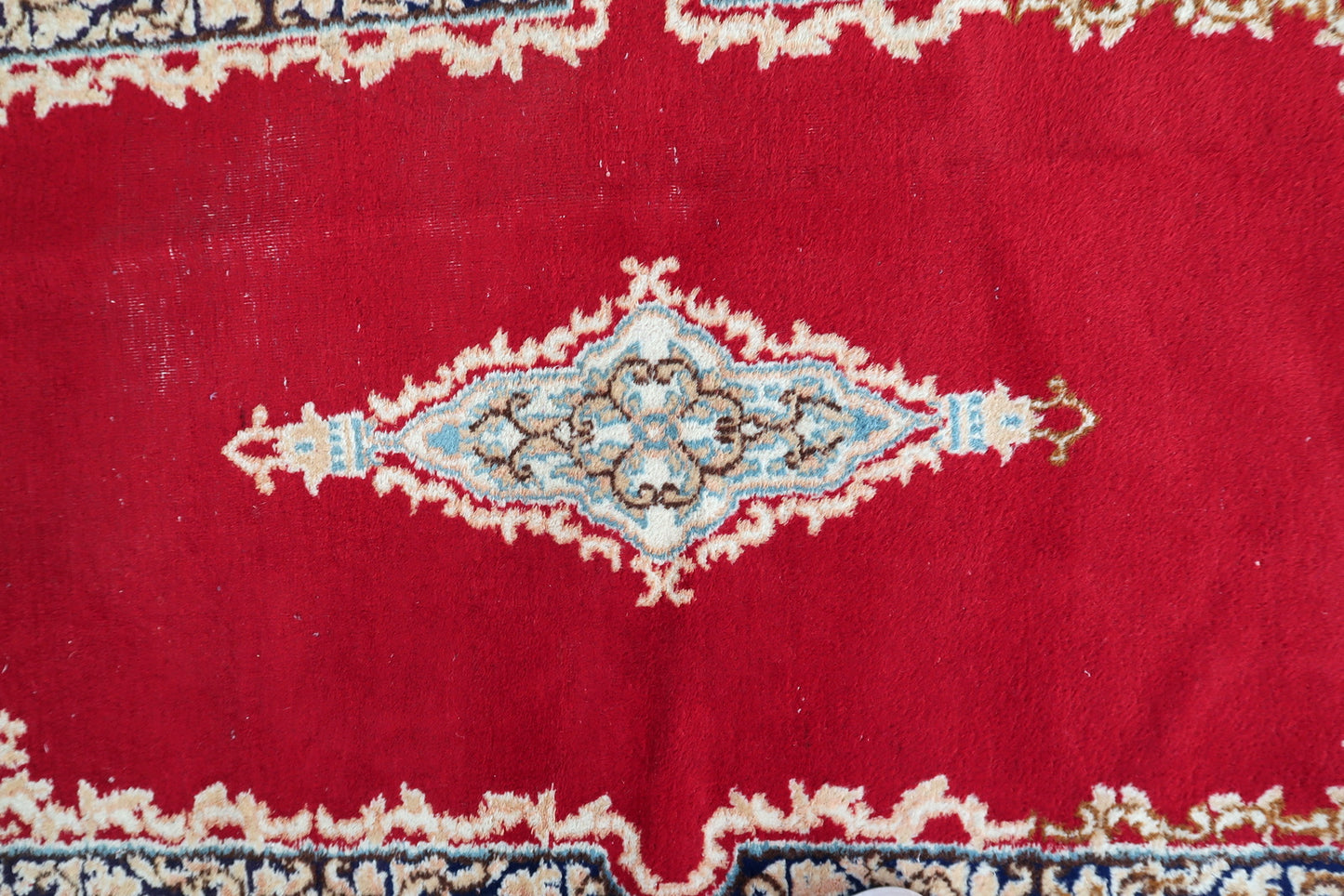 Hand-knotted Kerman rug circa 1950s with soft cream rose pink and deep navy color palette

