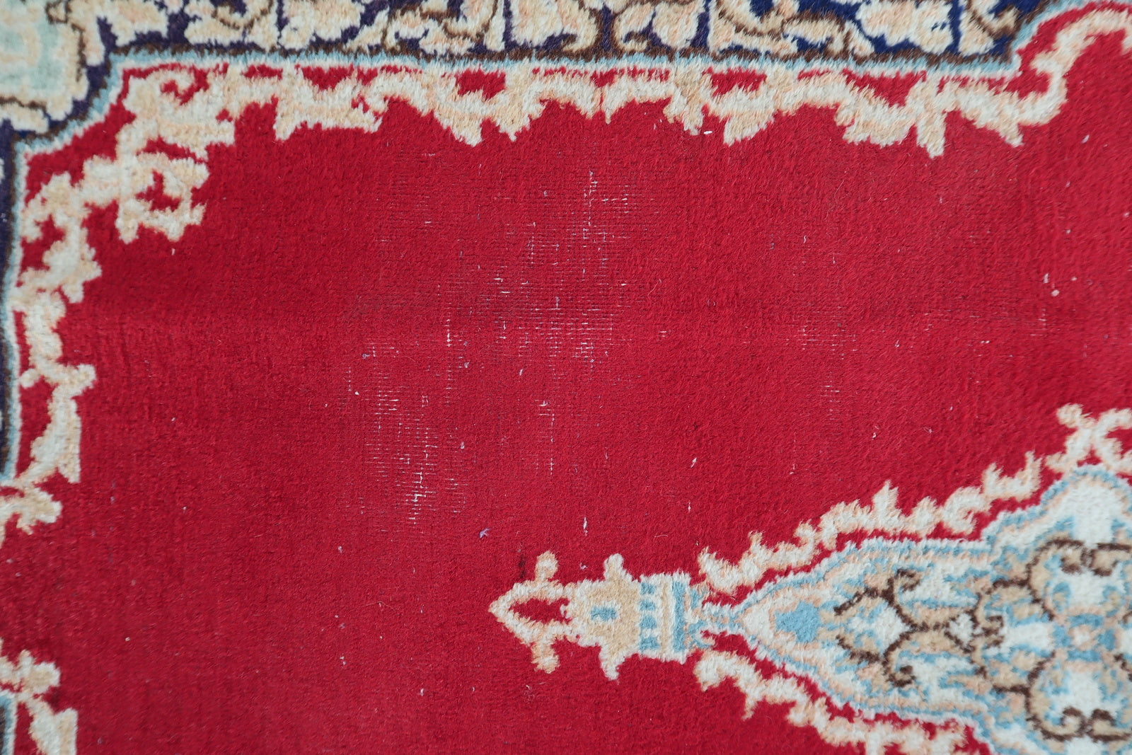 Vintage Persian Kerman rug texture and fine hand-spun wool pile detail with areas of low pile

