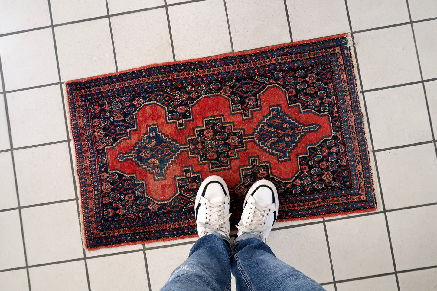 Vintage Senneh rug detail, showcasing precise geometric pattern and craftsmanship