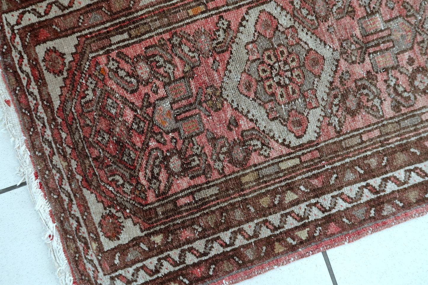 Antique Hamadan rug detail, showing hand-knotted wool texture and craftsmanship