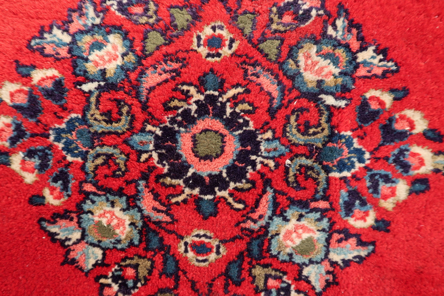 Persian Hamadan rug close-up, showing hand-knotted wool texture and pattern