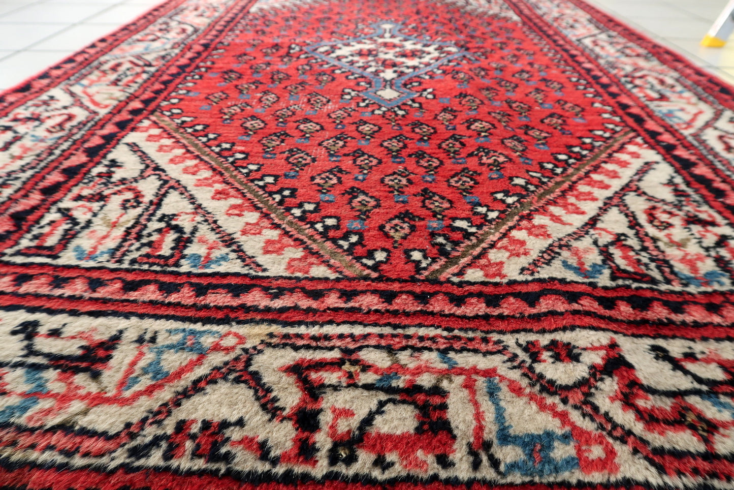 Vintage Seraband rug corner detail, handmade wool with aged patina