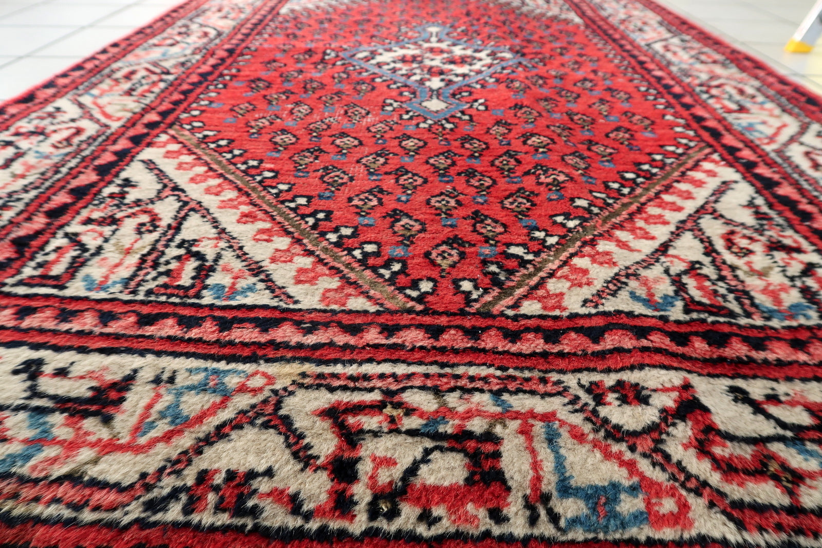 Vintage Seraband rug corner detail, handmade wool with aged patina