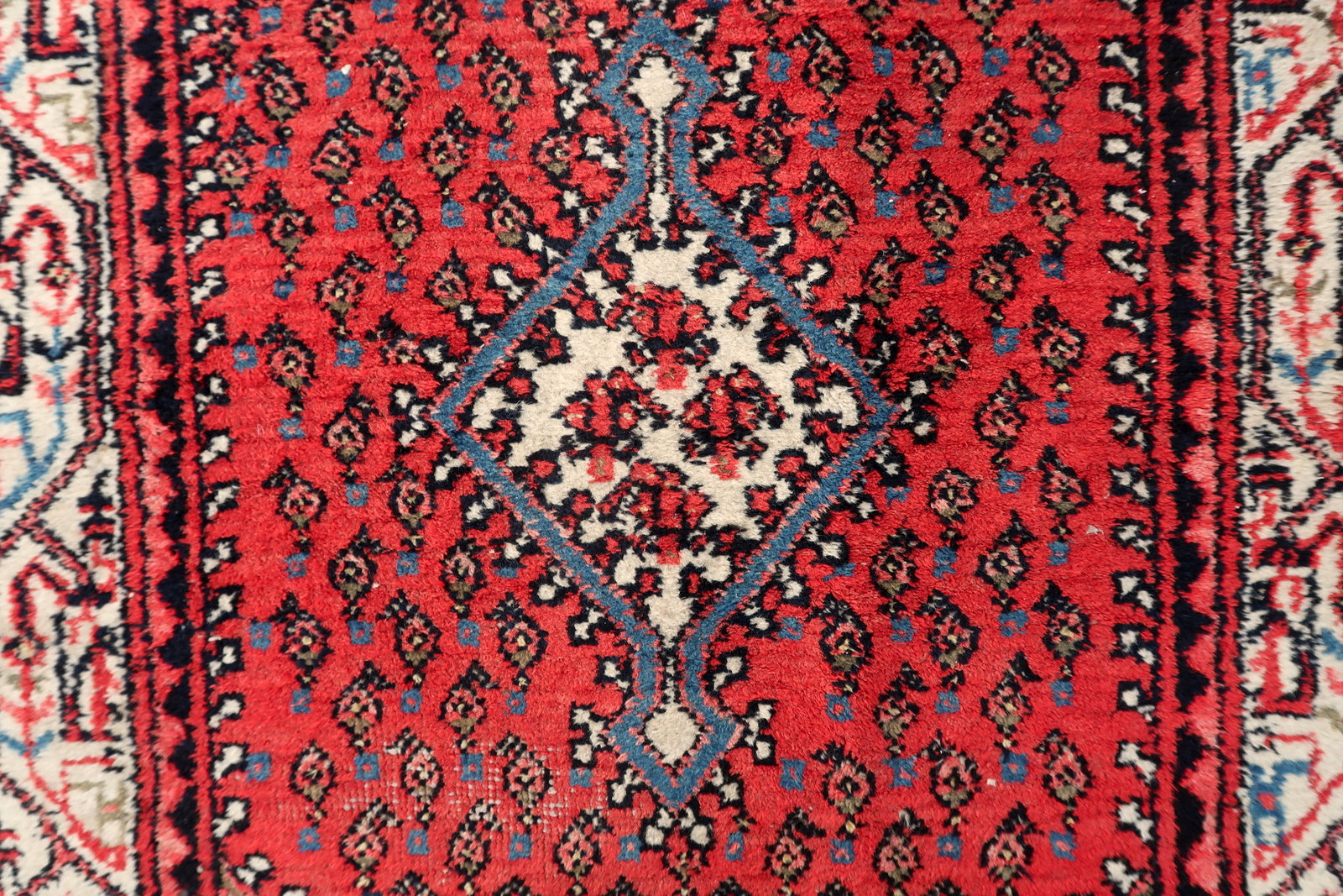 Vintage Indian rug full view, Seraband design with repeating paisley motifs