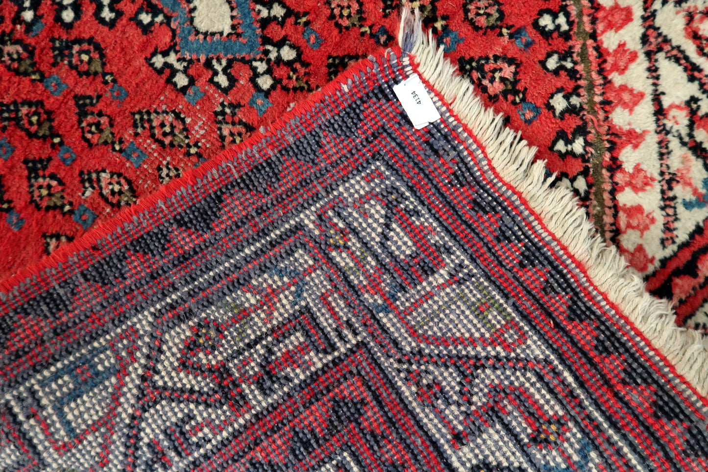Indian Seraband rug detail, showcasing dense weave and geometric repetition