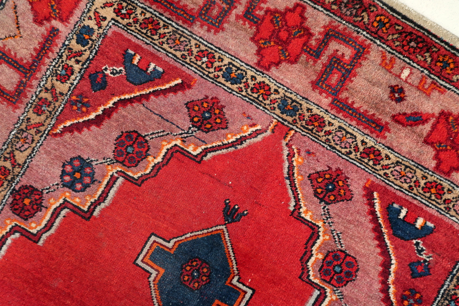 Persian Malayer rug close-up, showing detailed hand-knotted wool texture