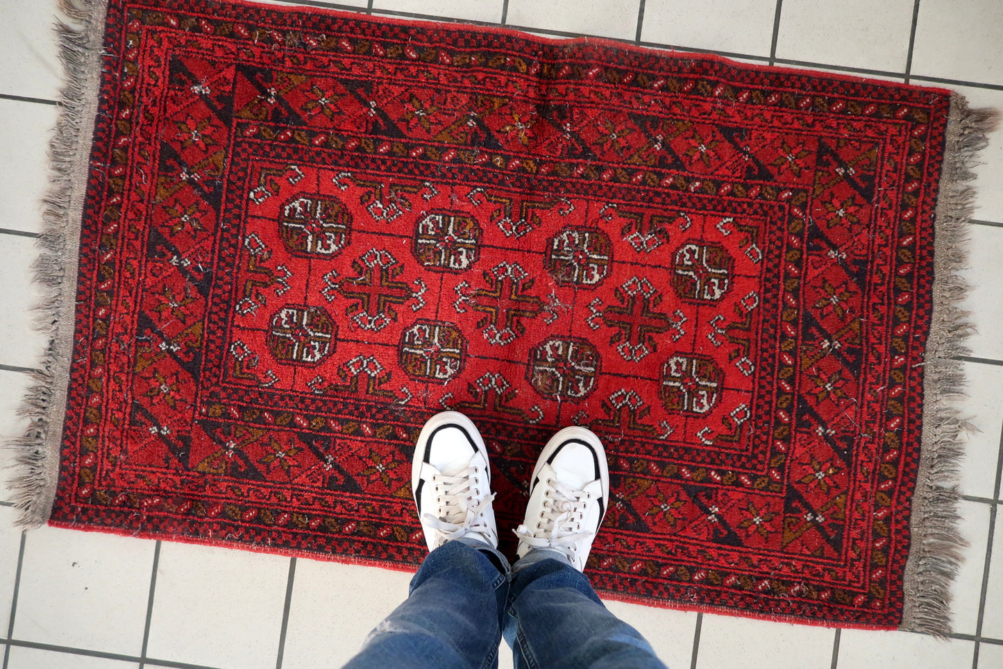 Hand-knotted Ersari rug detail, geometric motifs and natural dye colors
