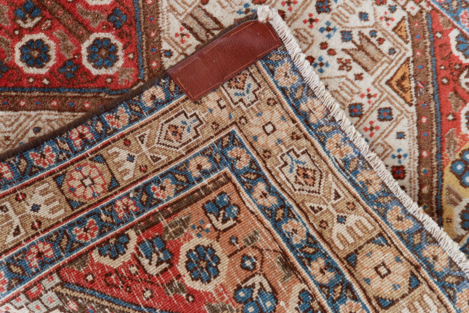 Antique Persian Malayer rug detail, intricate floral and vine motifs