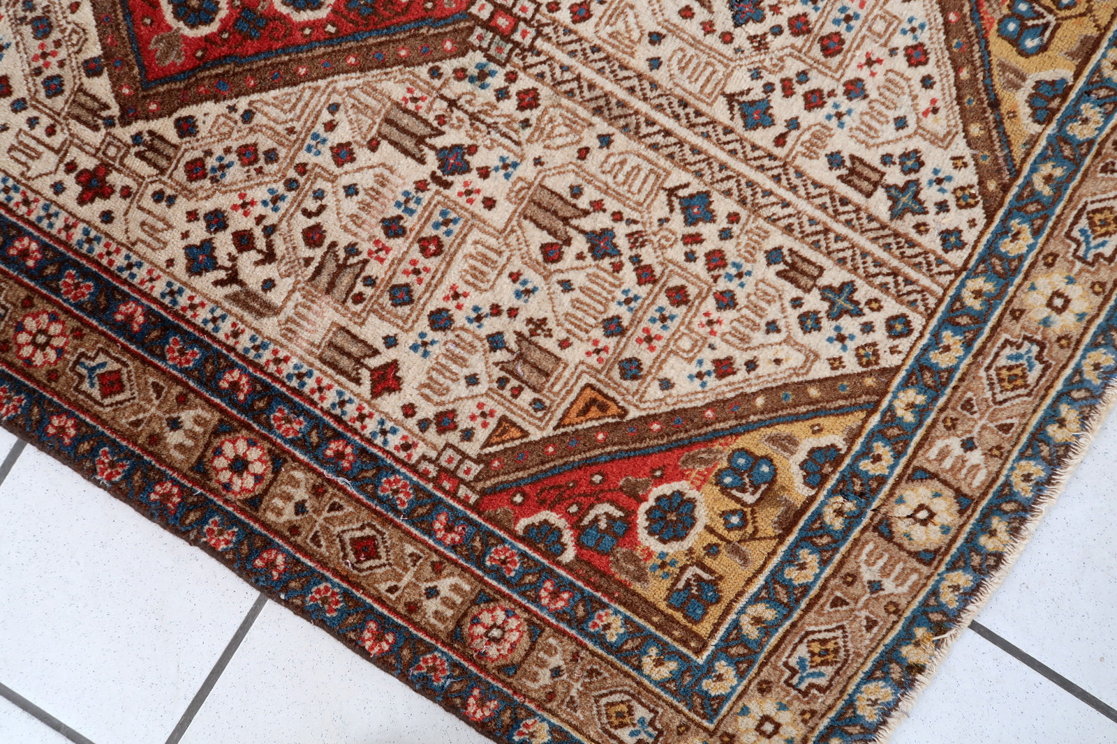 Vintage Persian Malayer rug corner detail, showcasing craftsmanship and patina