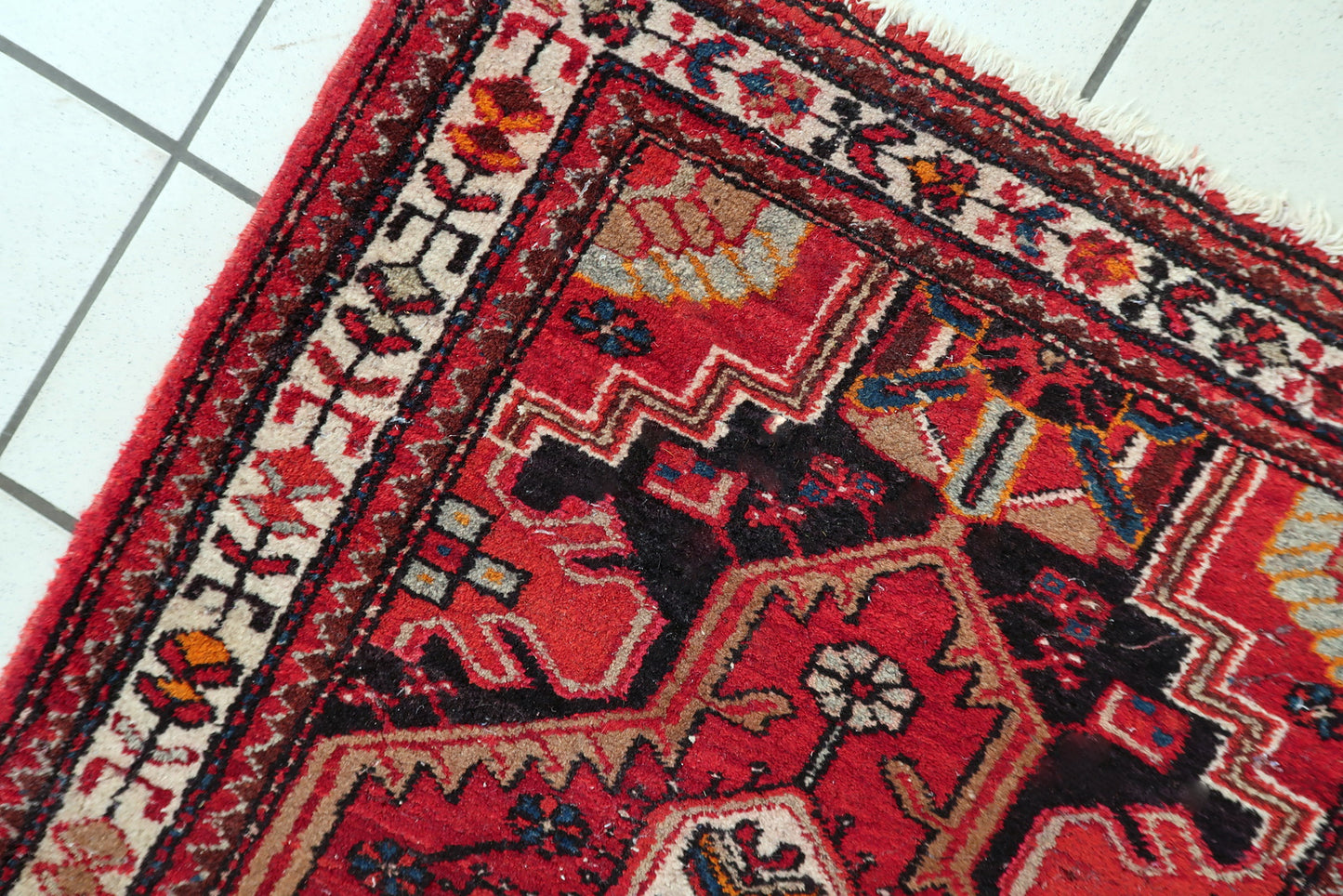 Antique Hamadan rug close-up, showing detailed hand-knotted wool texture