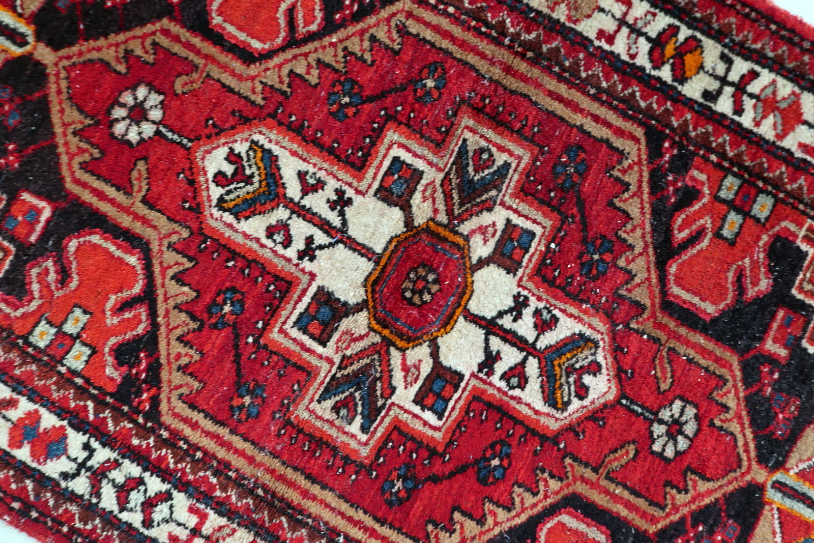Antique 1920s Hamadan wool rug, tribal design with symmetrical medallion