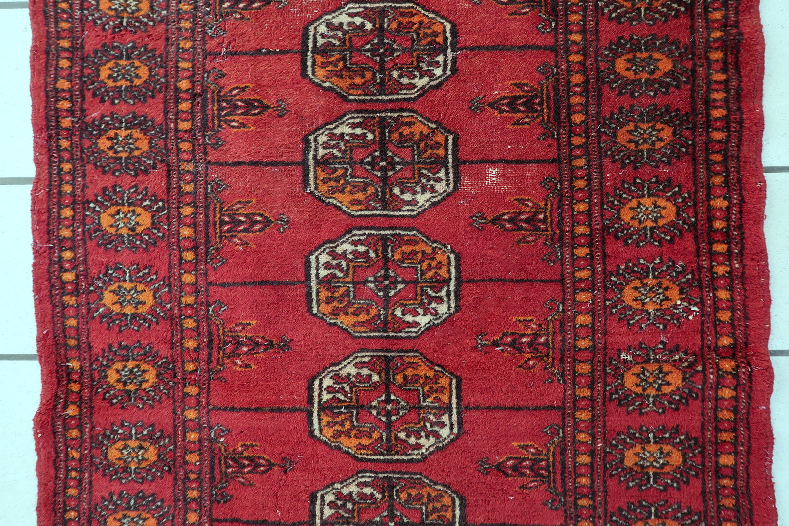 1940s Uzbek rug, Bukhara style with repeating octagonal medallions
