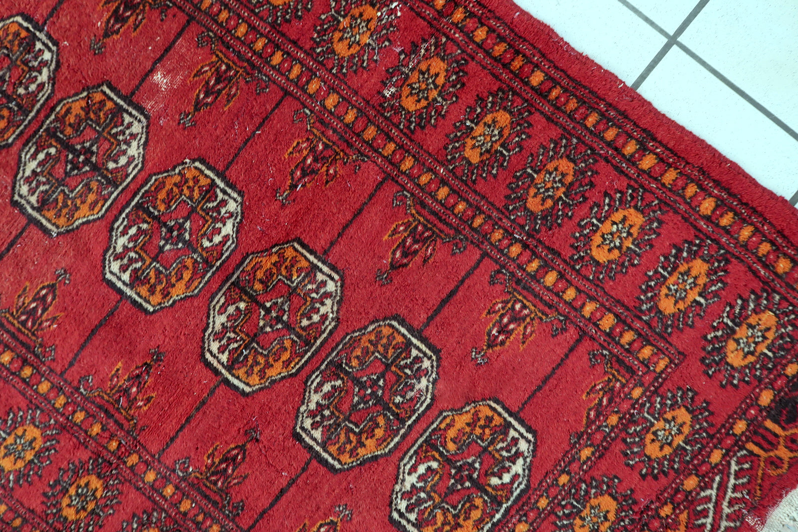 Vintage Central Asian Bukhara rug, wool carpet with classic tribal layout