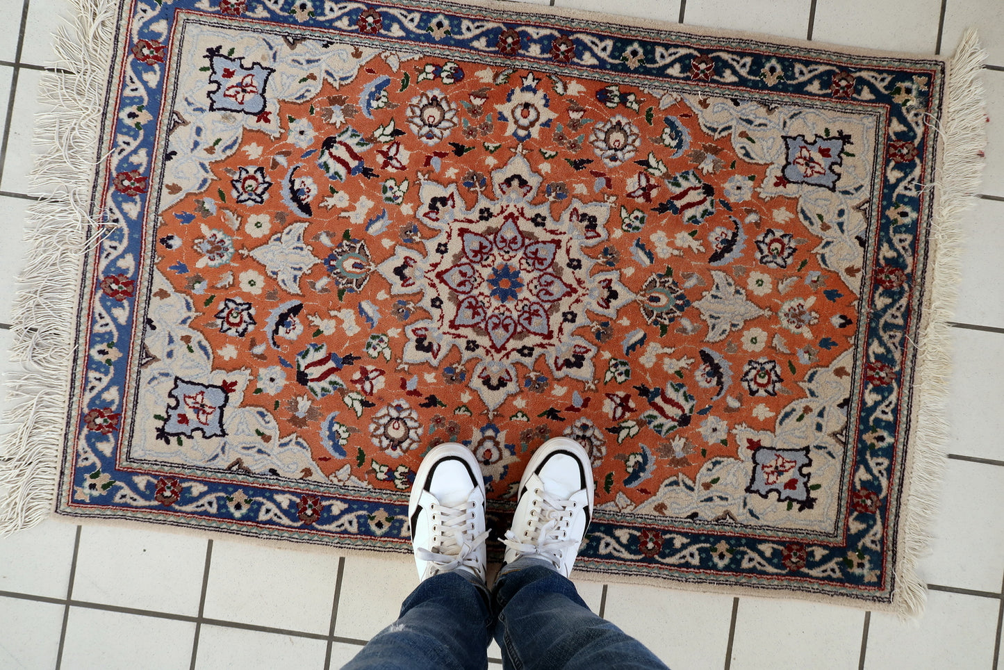 Tabriz rug texture detail, dense wool pile with silk highlights and sheen