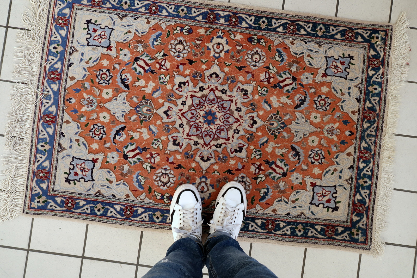 Tabriz rug texture detail, dense wool pile with silk highlights and sheen