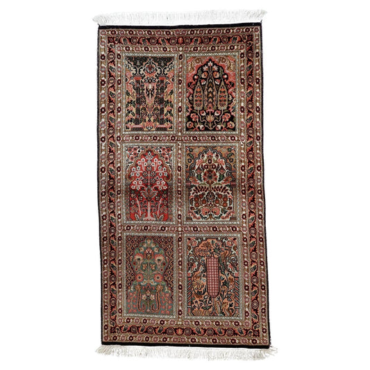Vintage 1950s Persian Qum silk rug, hand-knotted with intricate floral design