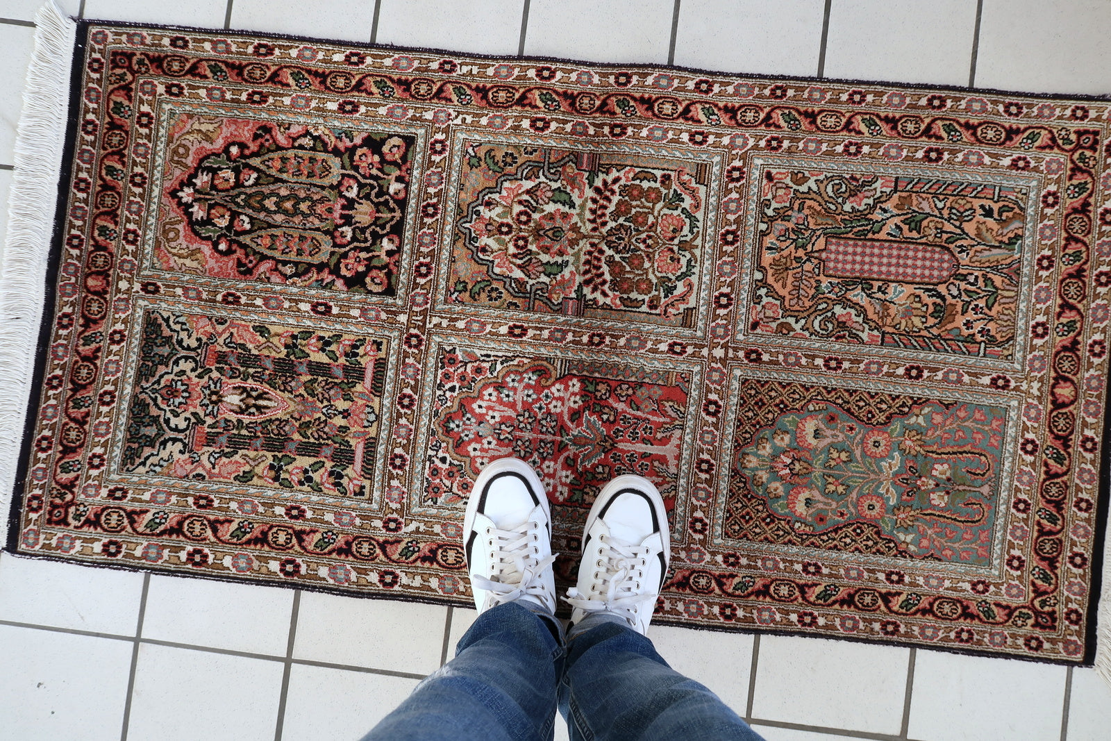Persian Qum silk rug fringe detail, delicate handmade craftsmanship