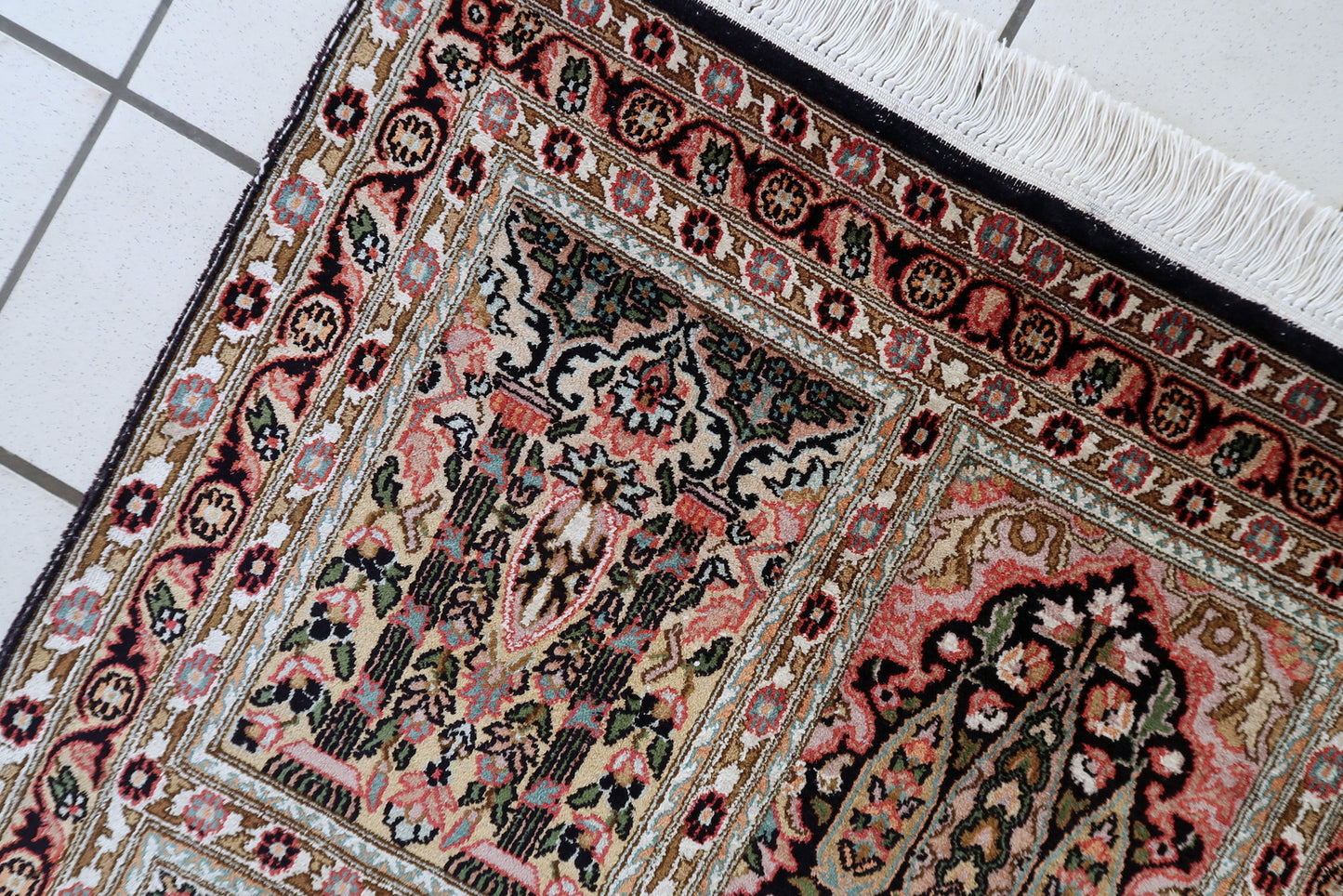 Vintage Qum rug close-up, showing silk highlights and luminous texture