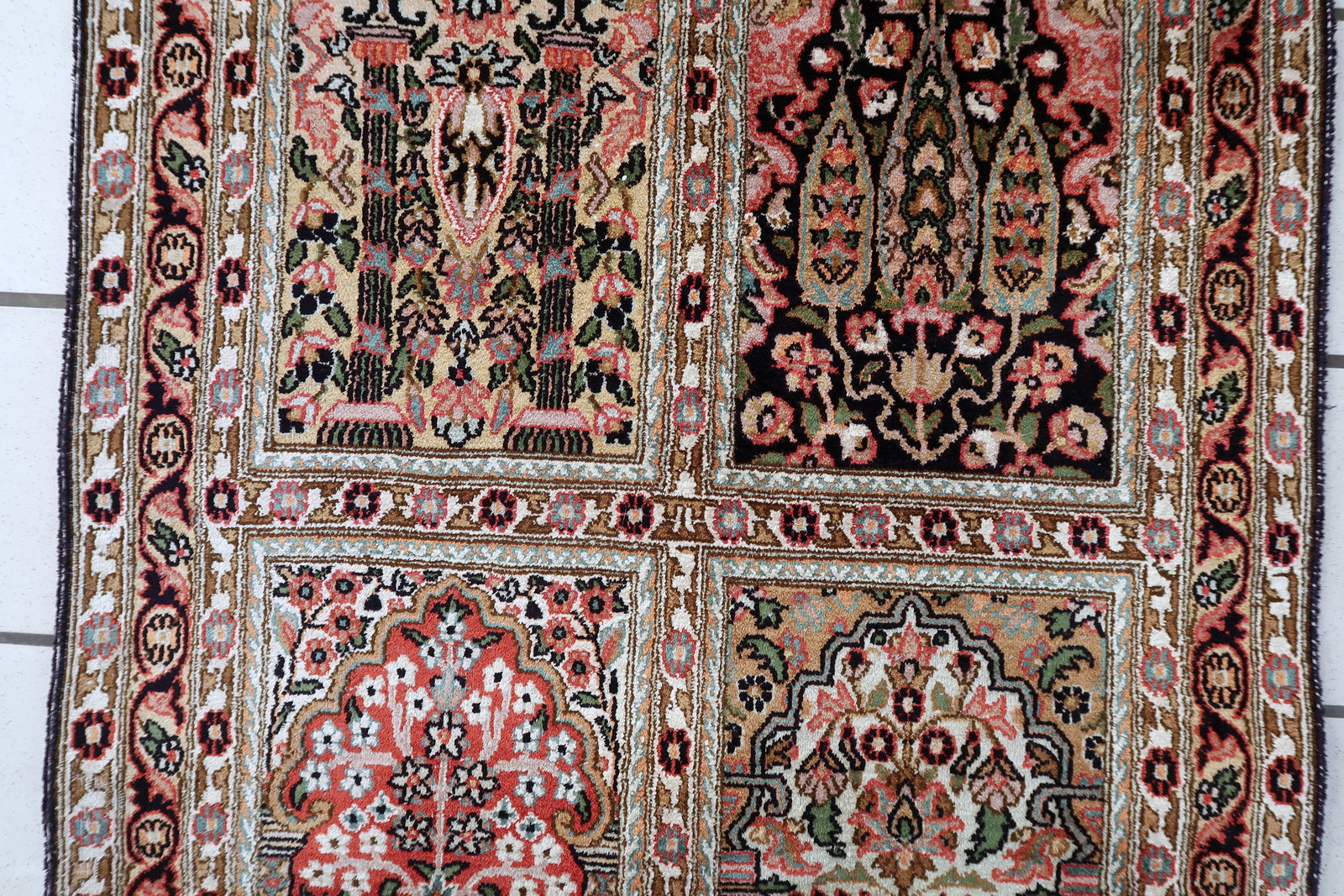 Hand-knotted Persian Qum rug, silk and wool with intricate floral motifs