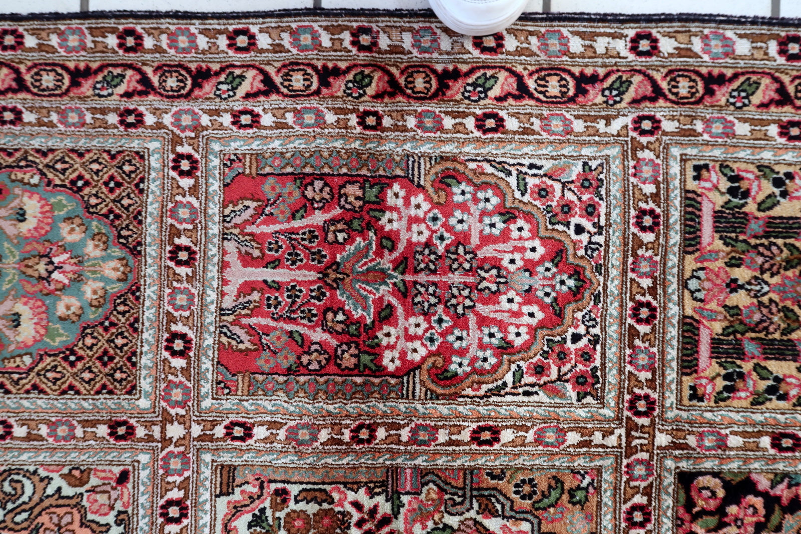 Persian Qum rug texture detail, soft silk pile with natural sheen
