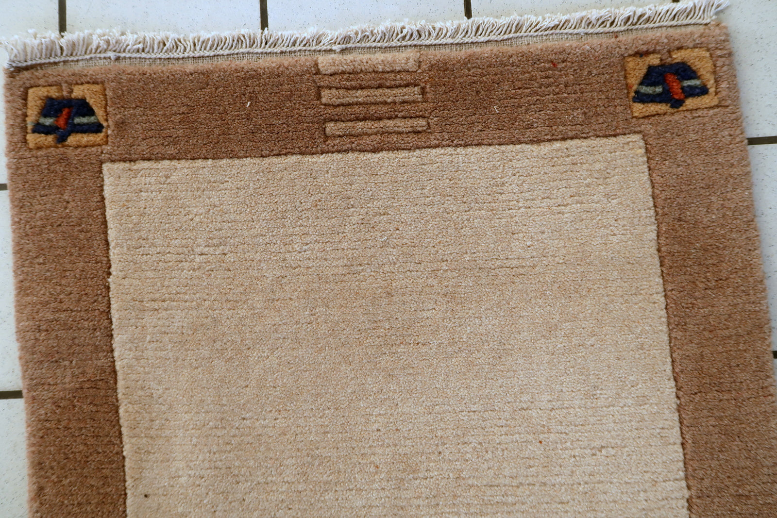 Vintage Tibetan wool rug texture detail, dense pile with natural sheen