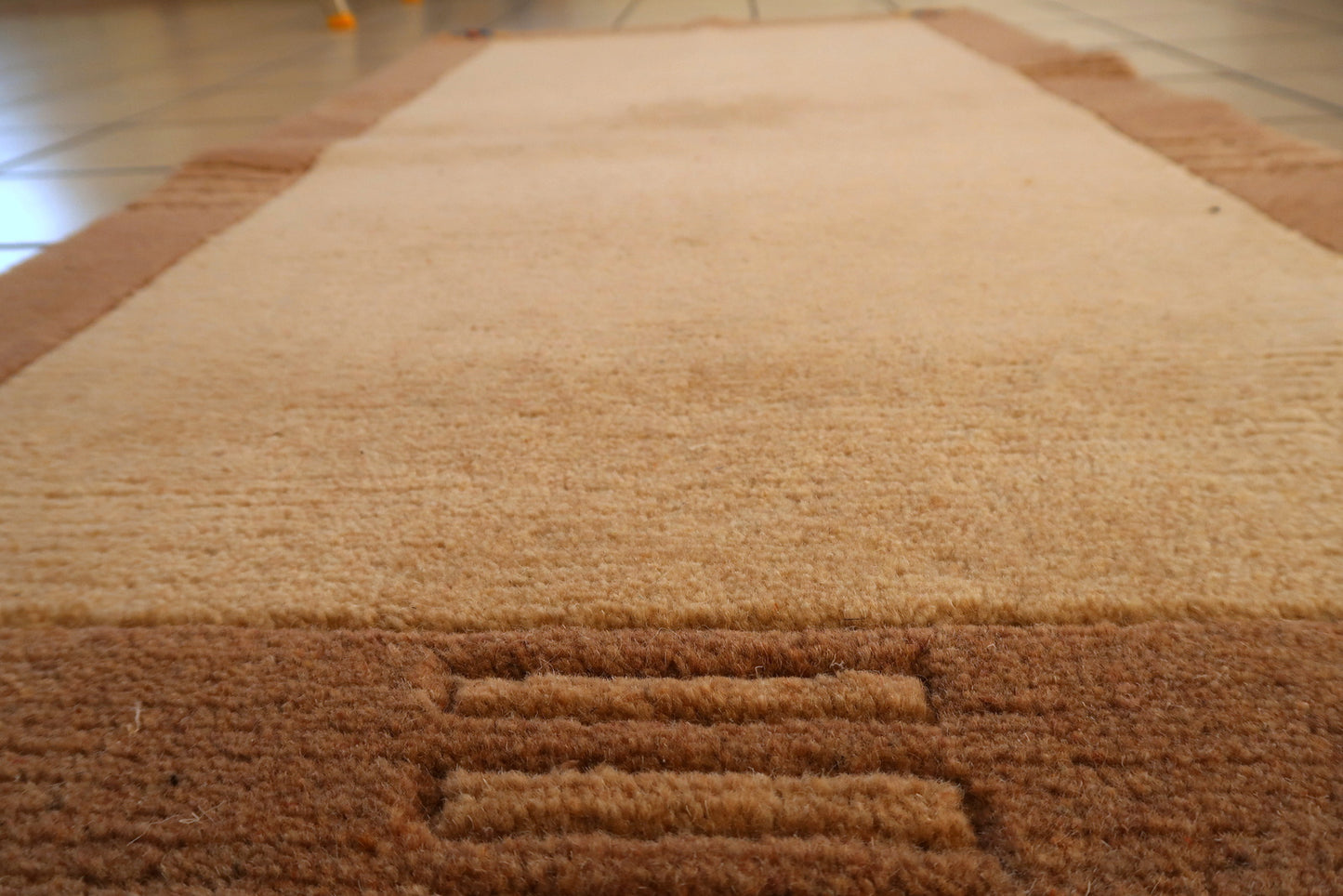 Vintage 1960s Tibetan rug, wool carpet with simple border and open field