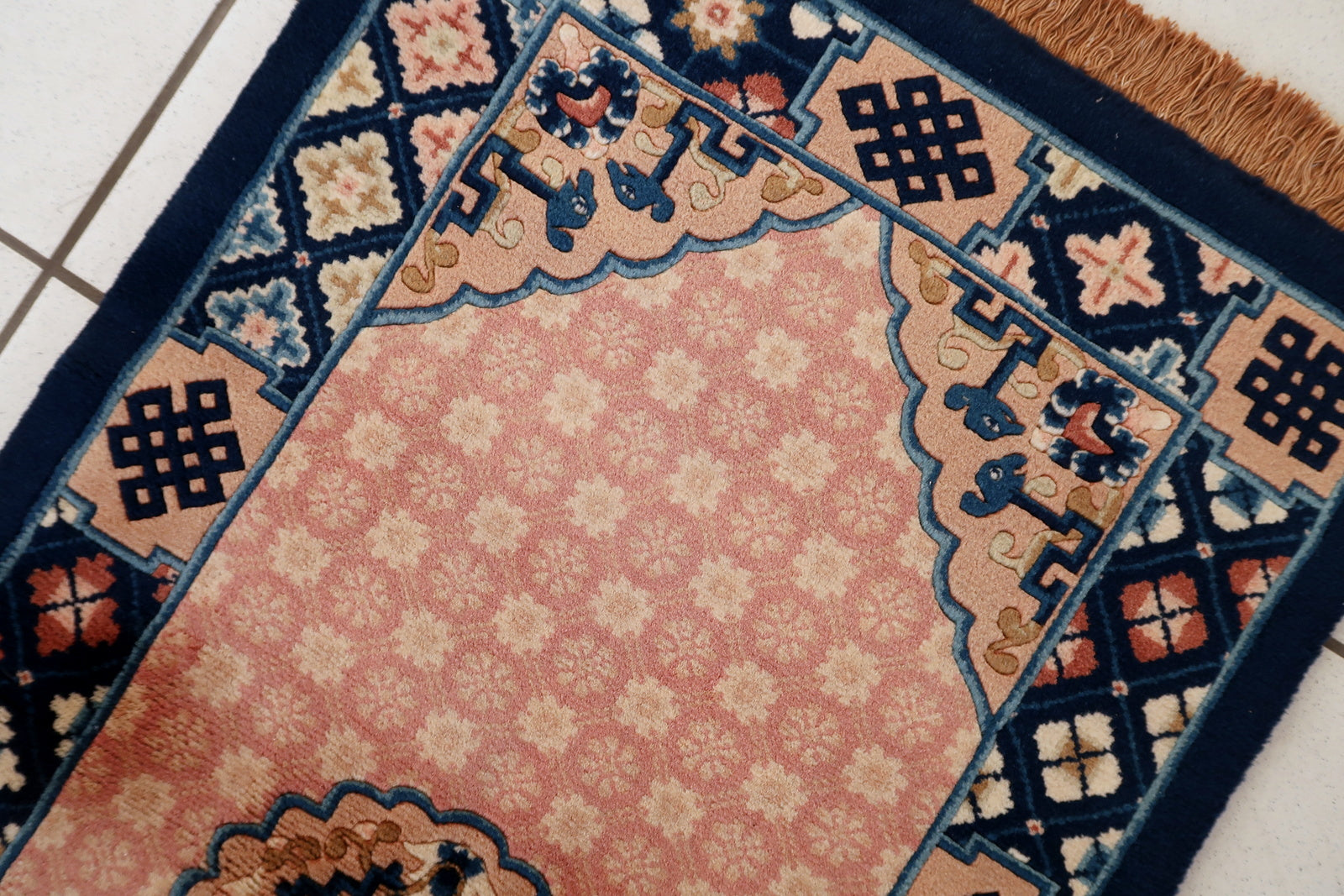 Vintage Chinese rug close-up, showing soft wool pile and lustrous texture