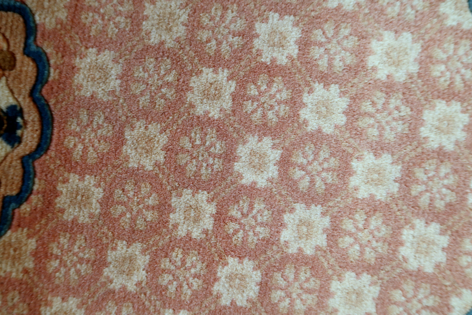 Chinese Art Deco rug corner detail, showcasing craftsmanship and patina
