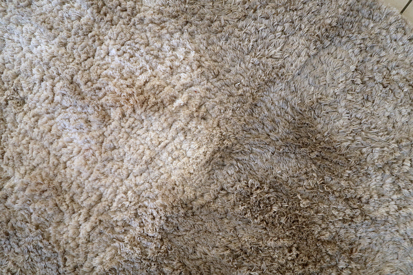 Scandinavian shag rug corner detail, showcasing plush texture and craftsmanship