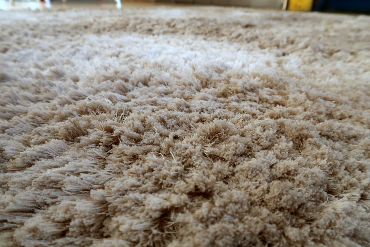 Flokati style wool rug texture detail, dense shaggy pile and softness