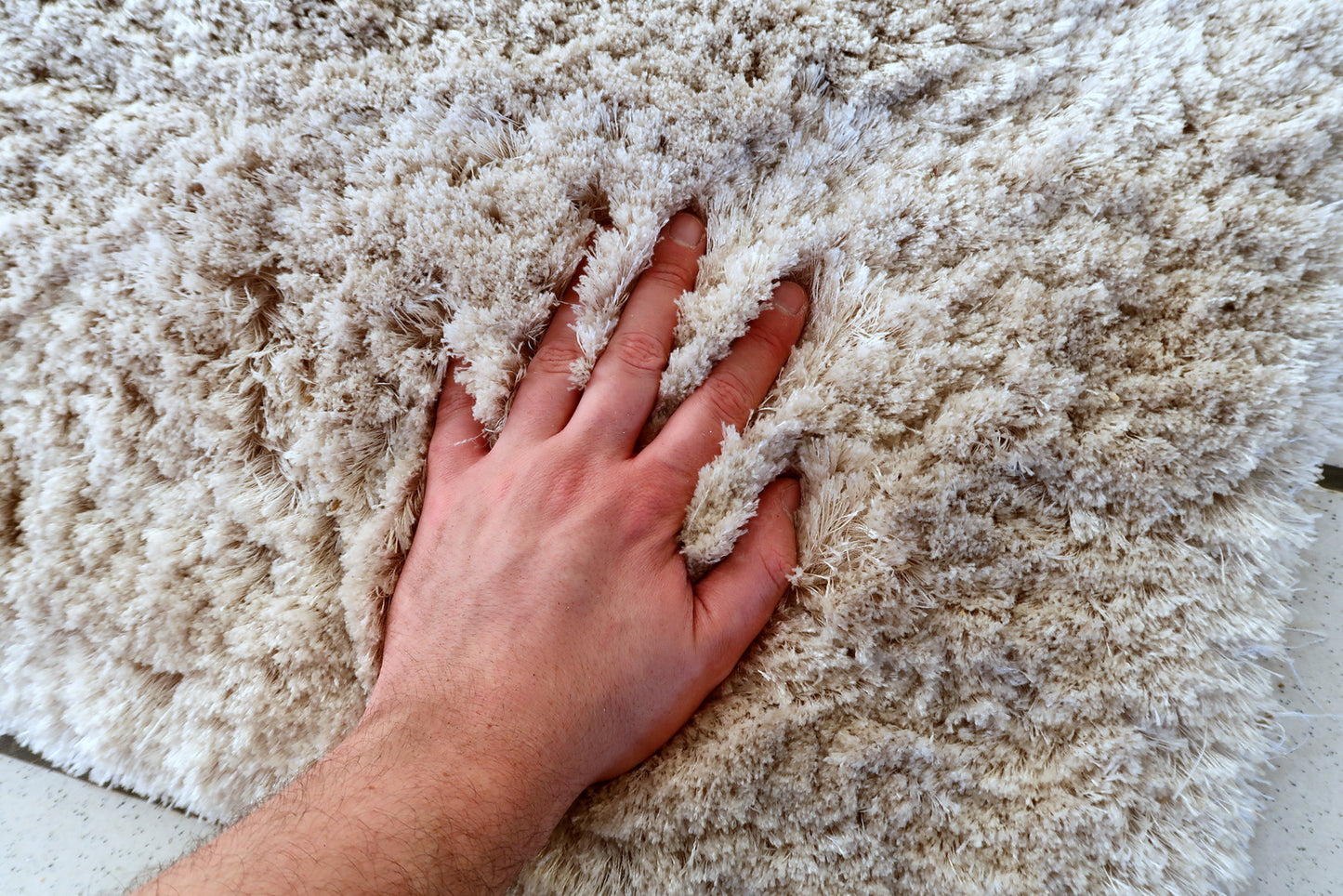Flokati style rug detail, thick pile and soft wool or acrylic fibers