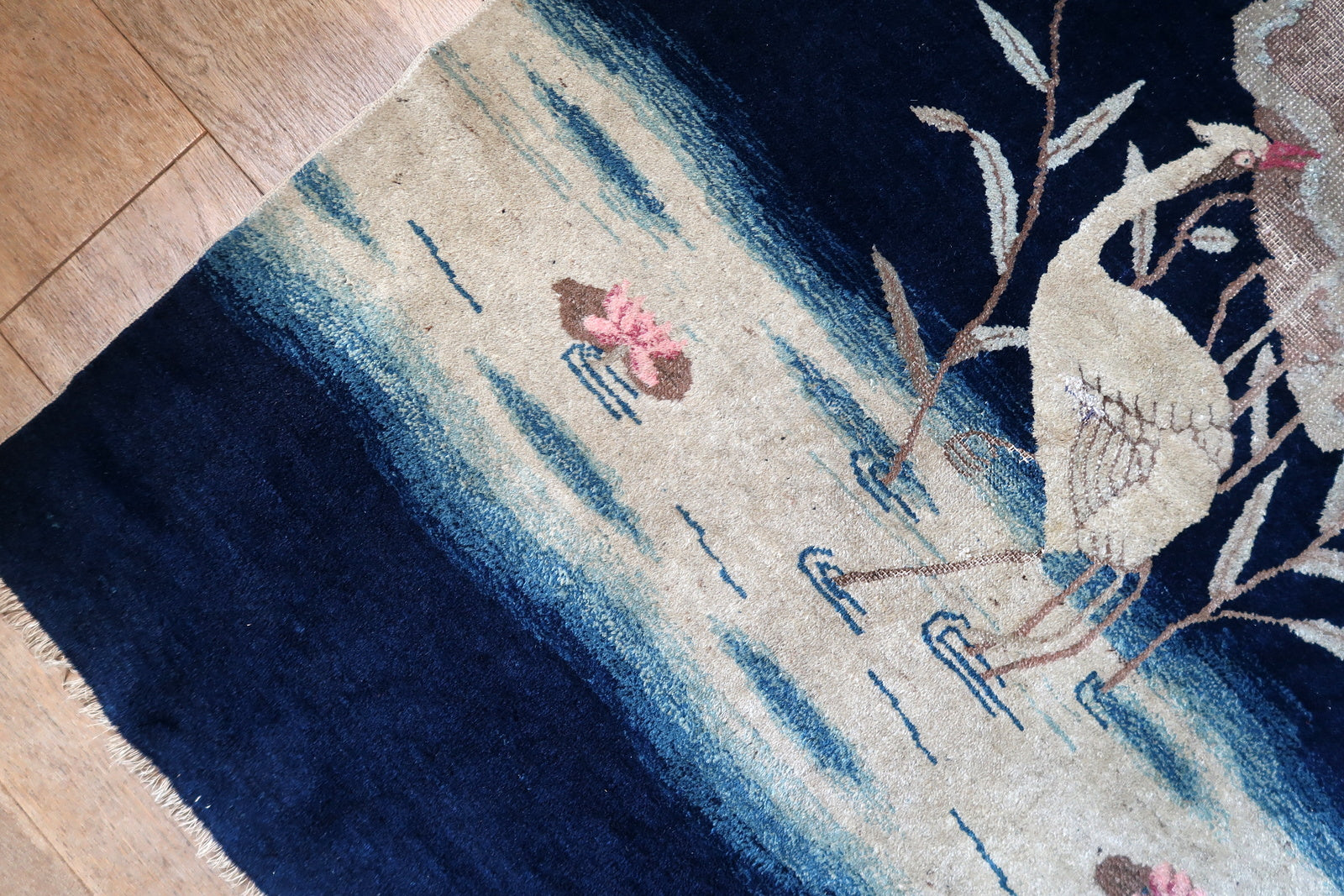 Antique Peking rug corner detail, showcasing craftsmanship and aged patina