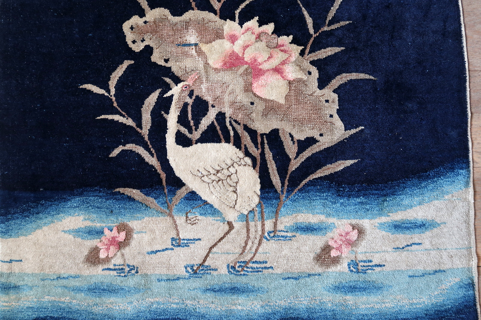 Antique Peking rug corner detail, showcasing craftsmanship and aged patina