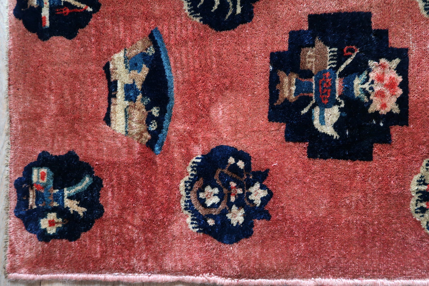 Antique Chinese Art Deco rug corner detail, showcasing craftsmanship and patina