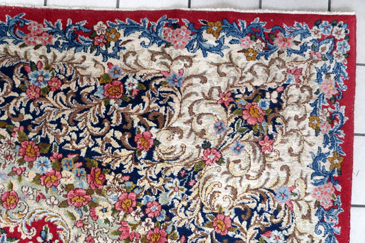 Vintage Persian Kerman rug full view, red field with intricate floral motifs