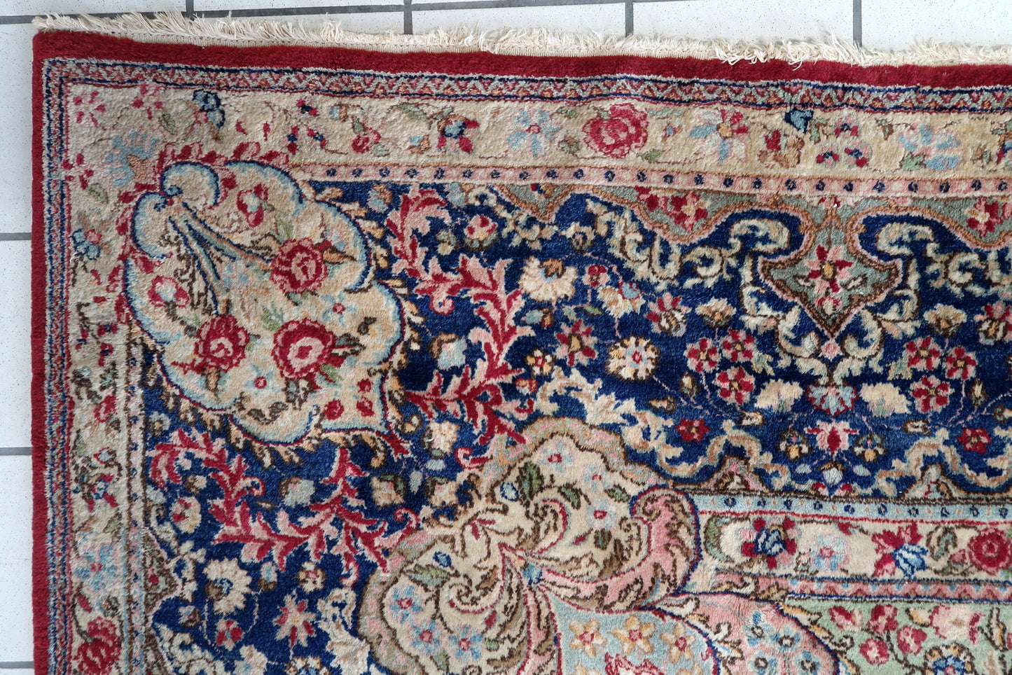 Vintage Persian Kerman rug full view, red field with intricate floral motifs