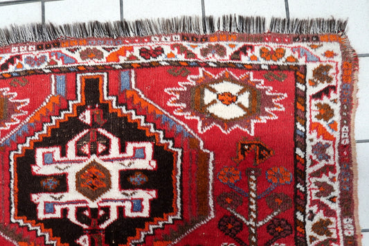 Persian Shiraz rug full view, tribal geometric design with rich red tones