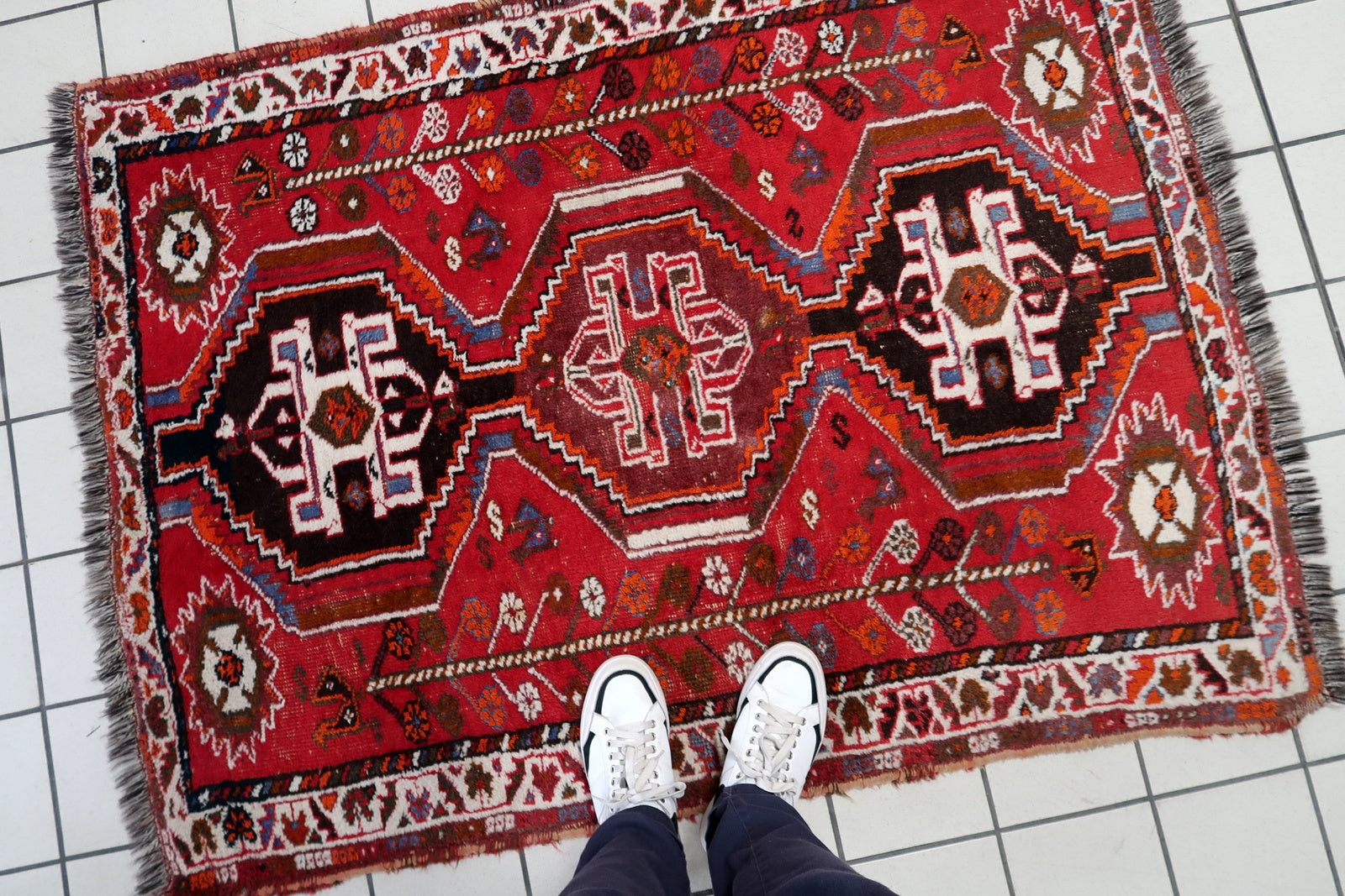 Hand-knotted Persian Shiraz rug, red field with traditional tribal layout