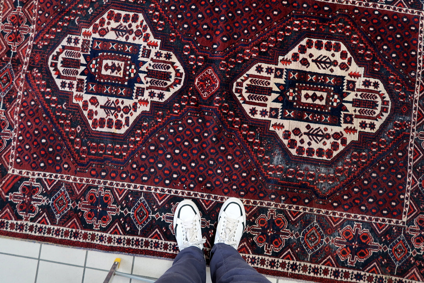 Vintage Afshar wool rug texture detail, dense pile with natural sheen