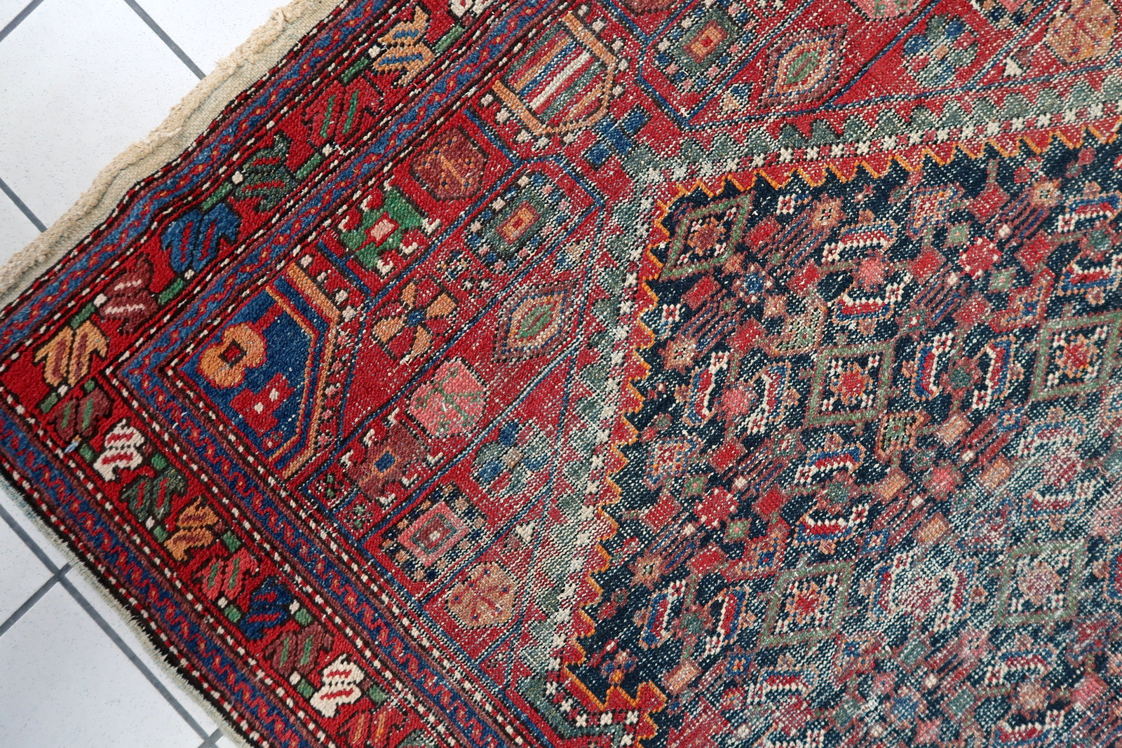 Distressed antique Persian Hamadan rug 1920s wool 4 ft x 6.5 ft village weaving tradition.

