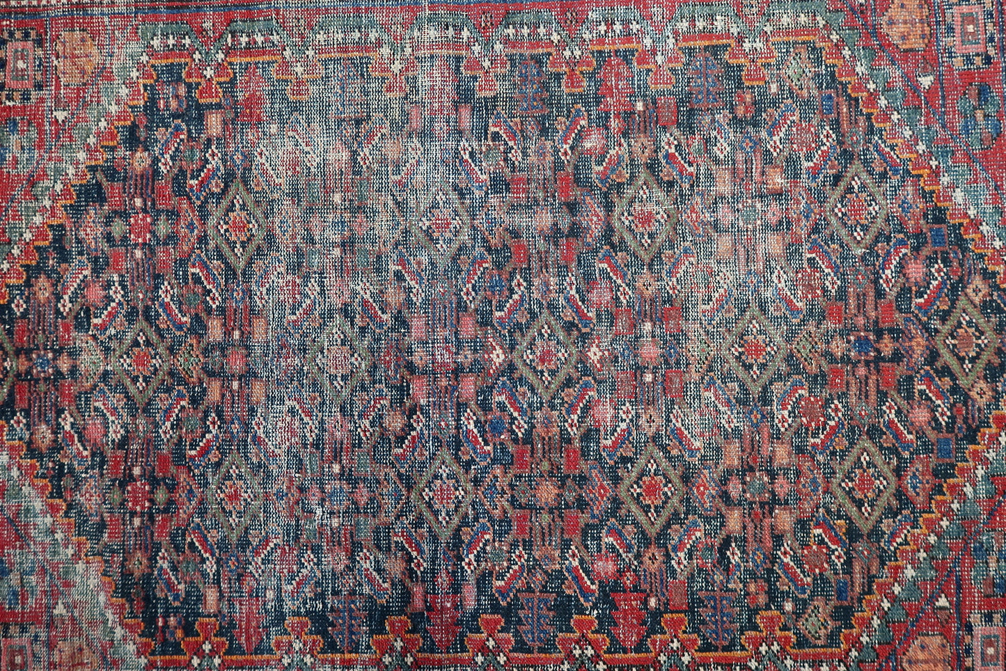 1920s antique Persian Hamadan carpet geometric all-over Herati motif red navy blue ivory muted green.

