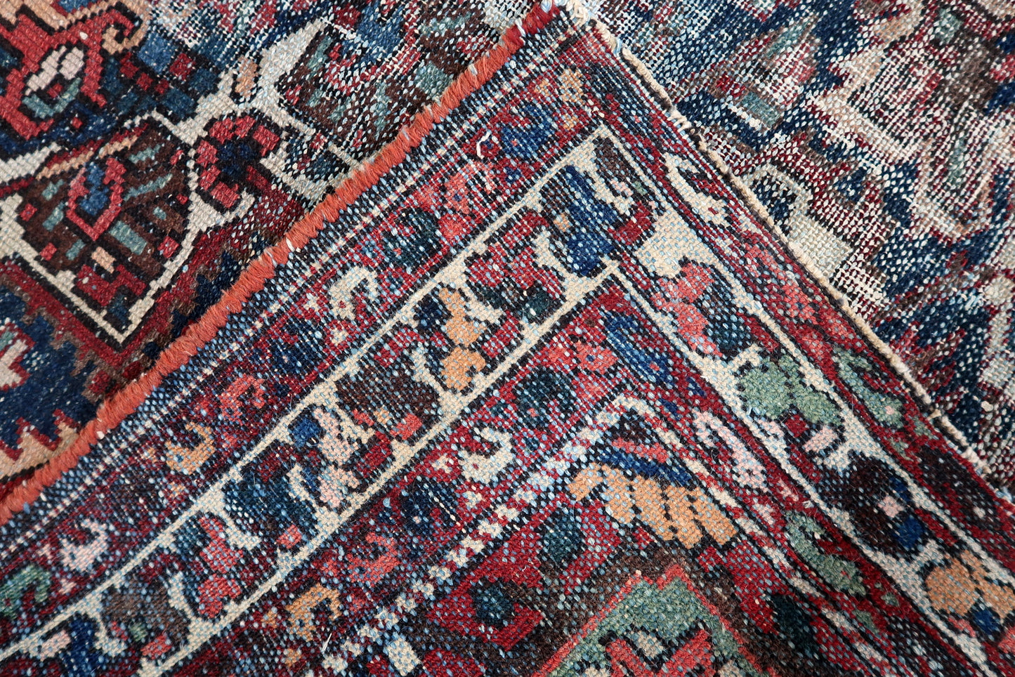 A beautifully worn 1920s Persian Hamadan rug with a bold geometric medallion, softened by a century of gentle fading and use.

